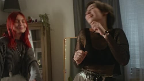 Happy Young Adults Dancing Together Indoors