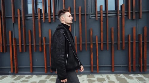 Guy in Casual Clothes Adjusts His Jacket and Looks Around Man Goes to Work