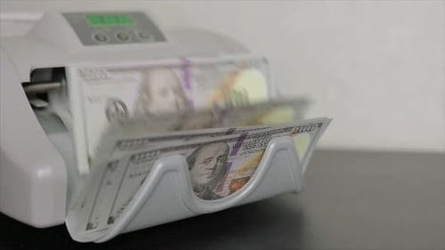 Machine is Counting Money at Work