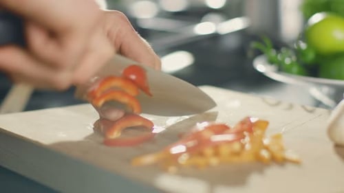 Close-up of a Chef Masterfully Cutting Colorful Vegetables on Cutting Board. Tomatoes and Mushrooms