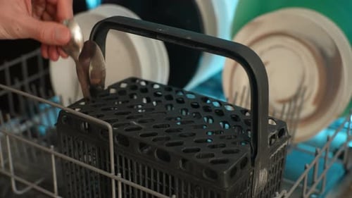 Loading Silverware Into Dishwasher Utensil Basket
