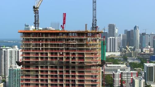 Real Estate Development in Miami Urban Area Tower Lifting Cranes at High Residential Apartment