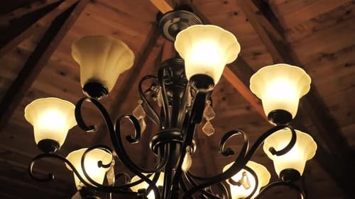 Elegant Chandelier with Decorative Lamps and Wooden Ceiling