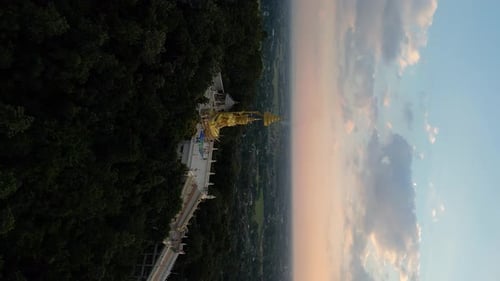 Vertical flight over Buddha statue on top of Wat Phra Doi Saket