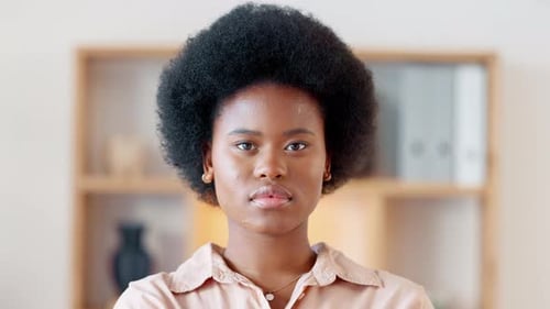 Confident Woman Poses in Front of Bookshelf