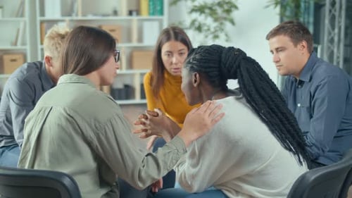 Group of Young Adults Talking in Support Circle