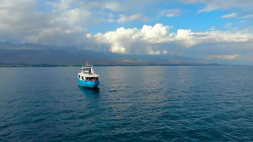 Boat Sailing on the Sea with Mountain Views