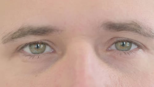 Close Up of Blinking Male Eyes Of Caucasian Man