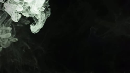 White Smoke Flowing Across Black Abstract Background