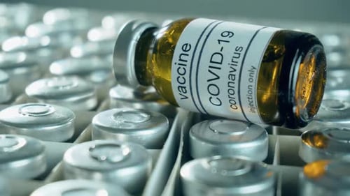 COVID-19 Vaccine Vials Prepared For Injection