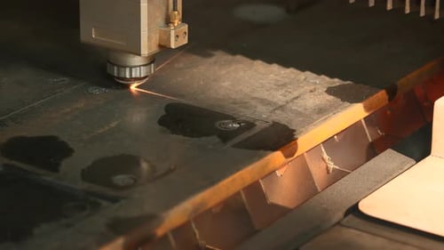 The process of cutting parts from a sheet of metal using a CNC machine