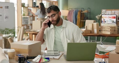 Box, laptop and phone call with man in office for distribution, logistics or supply chain