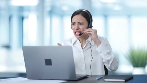 Angry Indian call center girl talking to customer through video call