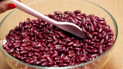 Kidney Beans Being Scooped with Spoon in Bowl