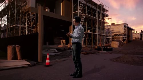 Asia Male Use Tablet and Feeling Headache At Building Site