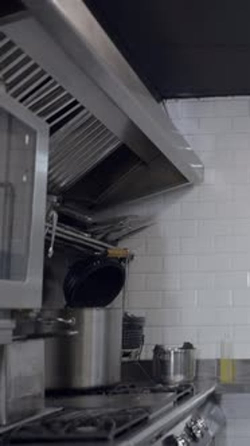 Slow Pushout of Counters and Stoves in Metallic Restaurant Kitchen