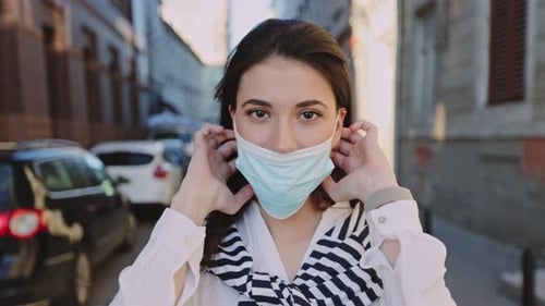 COVID19 Young Caucasian Woman Wearing Mask Protection on Isolation Period Standing on the Street and