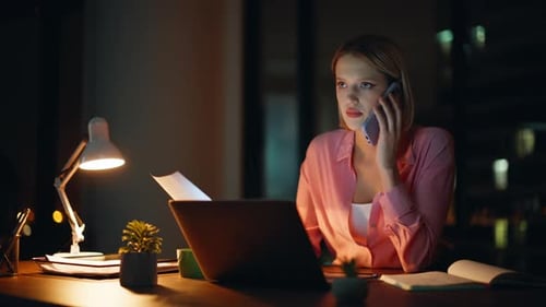Remote Professional Calling Cellphone Discussing Report at Night Office Closeup