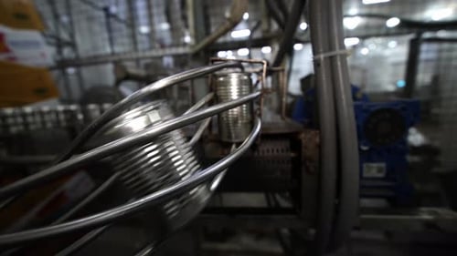 Conveyor line with the production of aluminum cans. Production of aluminum cans for drinks. Plant of