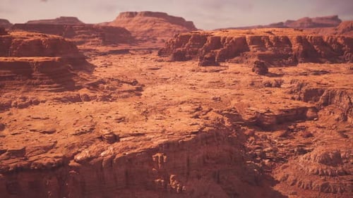 Open Canyon Background Featuring Warm Ochre Hues and Textured Formations