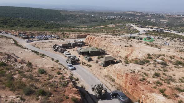 Israel Army soldiers on Humvee vehicles driving through training ground ...