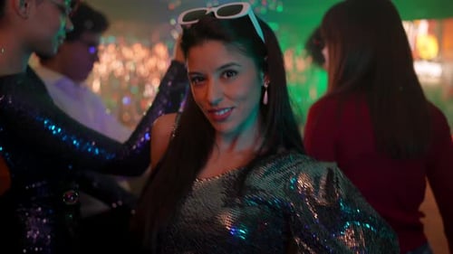 Group of Friends Dance at Colorful Party with Bubbles