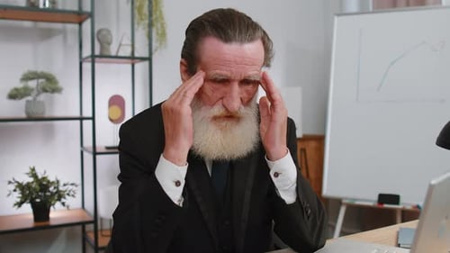 Tired Senior Business Man Suffering From Headache Problem Tension Migraine Stress at Home Office