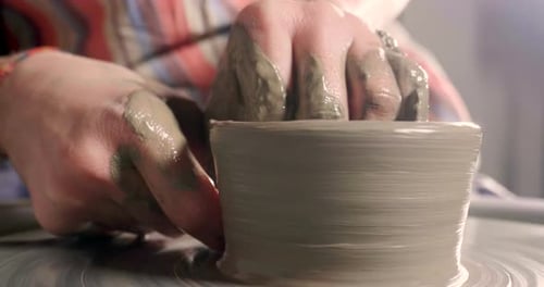 Hands Shape Clay on Pottery Wheel, Close Up