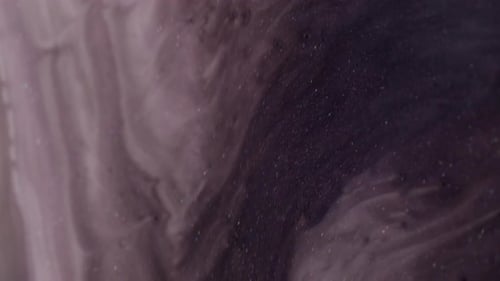 Abstract Liquid with Glitter Flowing Gently