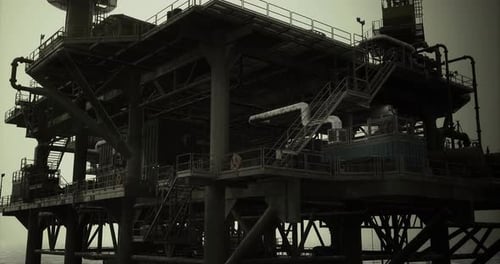 Oil Rig Under Moody Skies During Late Evening Offshore Operations