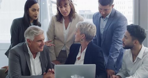 Business Team Collaborating on Laptop in Modern Office
