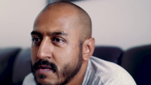 Man Looks Off Camera in Close Up Shot