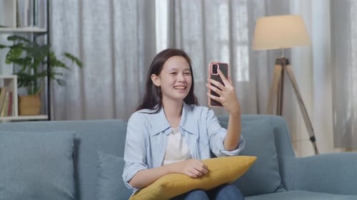 Happy Young Woman on Video Call at Home