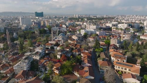 Forwards Fly Above Old Town District with Historic Tourist Sights Cityscape at Golden Hour Antalya