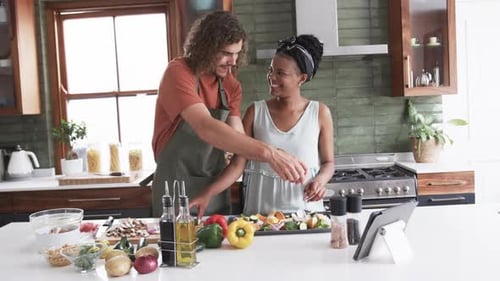Couple Prepares Vegetables Together in Modern Kitchen