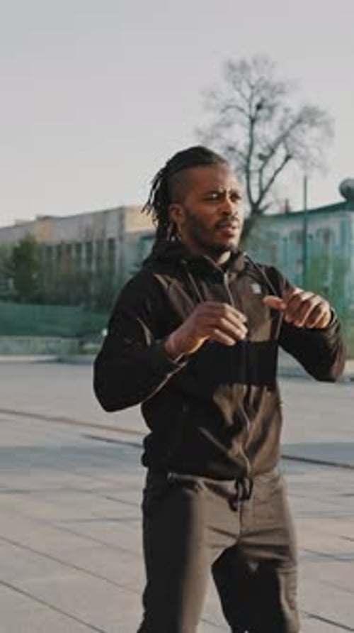 Four Young Sportsmen Basketball Players Hug and Shake Hands After the End of the Basketball Game