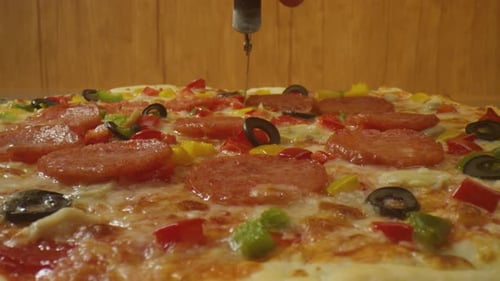 Pizza Cutting Close Up in a Home Kitchen