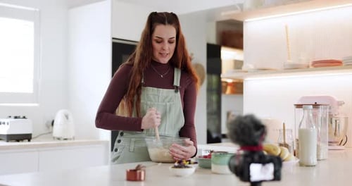 Woman Mixing Batter in Bright Modern Kitchen