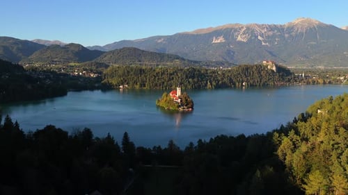 Lake Bled Island Church and Castle Nestled in Slovenian Alps Landscape.