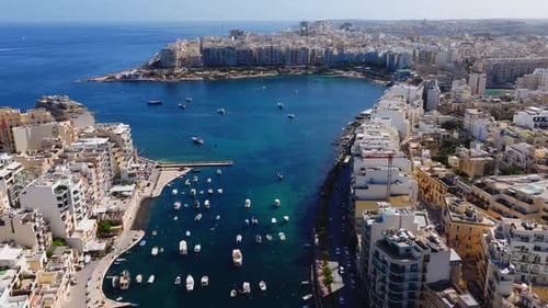 Aerial Sweep Over Sliema and Balluta Bay Malta at Midday