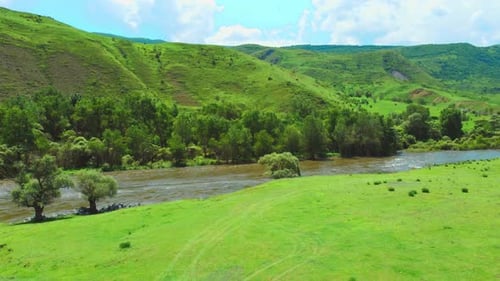 Beautiful natural scenery of river, tropical green forest with mountains