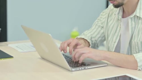 Close up of Hands Typing on Laptop
