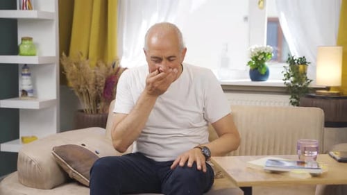 The sick old man can't stop coughing.