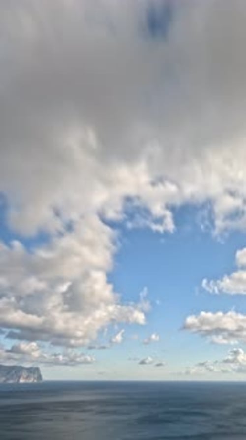 Ocean Clouds Sky Vast Blue Sea Meets Distant Land White Cumulus Clouds Moving Rapidly Across Bright