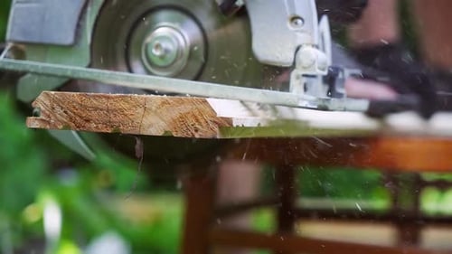 Construction Professional Operating Circular Saw on the Job
