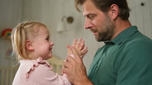 Father and Daughter Share Loving Moment at Home