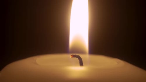 Close Up of Candle Flame Burning Brightly