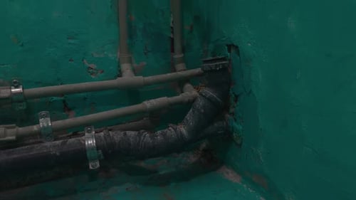 Close Up of an Electric Blue Underwater Pipe in a Corner of a Swimming Pool