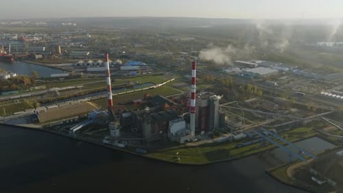 Aerial view of industrial power plant complex on a riverbanks