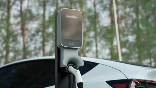 EV electric vehicle recharging battery in national park. Exalt